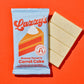 Carrot Cake bar next to a piece of white chocolate